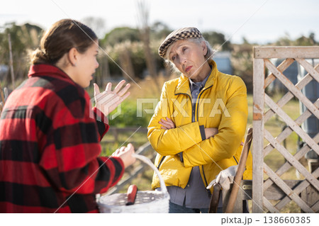 Conflict between female neighbors in country farm Conflict between female neighbors in country farm 138660385