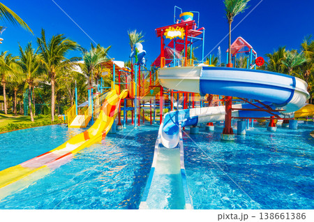 children's water park at the resort on summer vacation. Colorful aquapark with slides for kids in pool children's water park at the resort on summer vacation. Colorful aquapark with slides for kids in pool 138661386