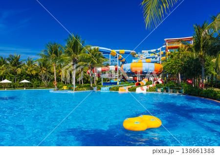 water park with slides and pipes for active extreme recreation at resort in summer. Big aquapark with a pool in tropics water park with slides and pipes for active extreme recreation at resort in summer. Big aquapark with a pool in tropics 138661388
