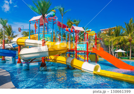 children's water park in the pool at resort on summer vacation. Colorful aquapark with slides for children in the pool children's water park in the pool at resort on summer vacation. Colorful aquapark with slides for children in the pool 138661399