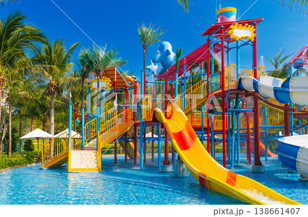 children's water park in pool at the resort on summer vacation. Colorful aquapark with slides for kids in the pool children's water park in pool at the resort on summer vacation. Colorful aquapark with slides for kids in the pool 138661407