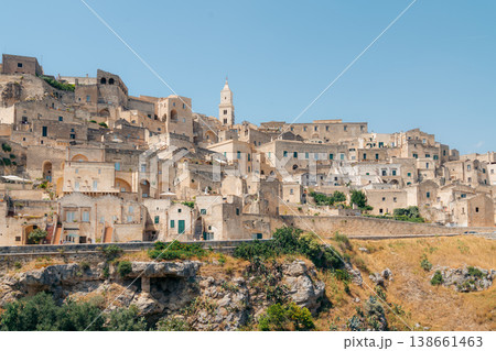 Matera, Italy: Historic Sassi cave dwellings and cathedral under a bright blue sky Matera, Italy: Historic Sassi cave dwellings and cathedral under a bright blue sky 138661463