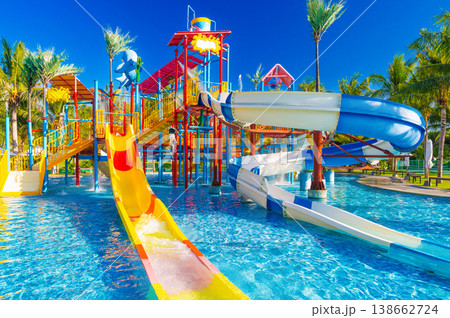 children's water park in the pool at the resort on summer vacation. Colorful aquapark with slides for kids in the pool 138662724