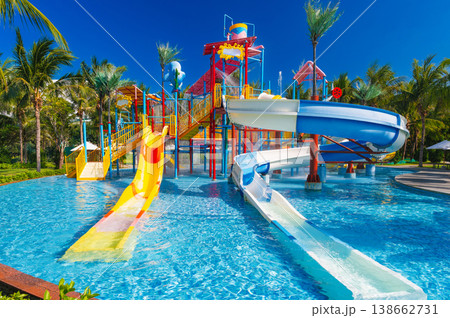 children's water park in pool at the resort on summer vacation. Colorful aquapark with slides for kids in the pool children's water park in pool at the resort on summer vacation. Colorful aquapark with slides for kids in the pool 138662731