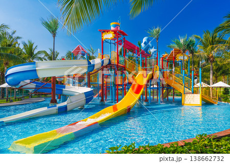 children's water park in the pool at resort on summer vacation. Colorful aquapark with slides for children in the pool 138662732
