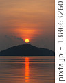 Serene sunrise over calm sea with silhouetted island creates tranquil atmosphere at Phuket city 138663260