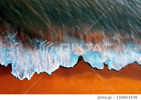 Aerial View of Striking Ocean Waves Rolling onto a Golden Sandy Beach Aerial View of Striking Ocean Waves Rolling onto a Golden Sandy Beach 138663436