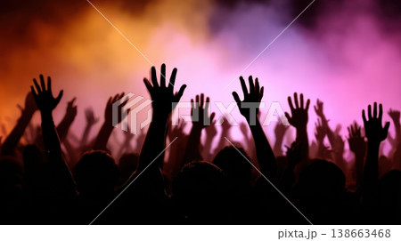 Joyful Crowd Celebrating at a High-Energy Concert with Colorful Strobe Lights and Smoke Effects Joyful Crowd Celebrating at a High-Energy Concert with Colorful Strobe Lights and Smoke Effects 138663468
