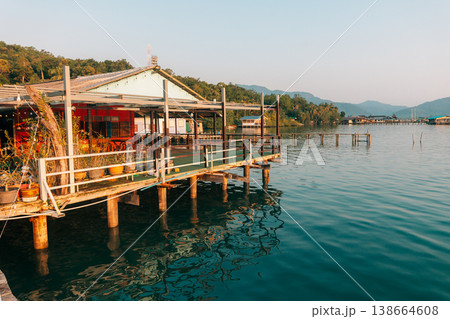 Waterfront wooden stilt houses and homestay over clear tropical sea. 138664608
