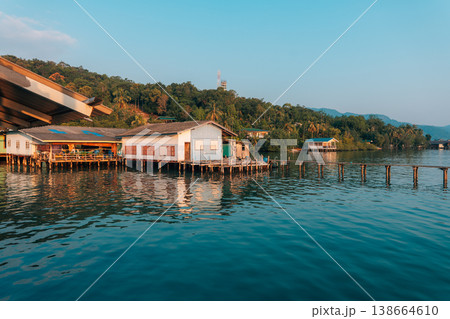 Waterfront wooden stilt houses and homestay over clear tropical sea. 138664610
