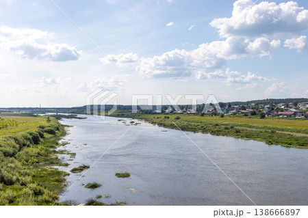 View to river with swampy banks Ecological issues River overgrown by vegetation 138666897