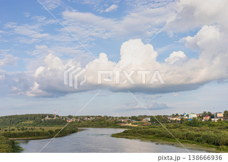 Scenic river landscape with majestic clouds in sky in Sovetsk, Kirov region, Russia 138666936