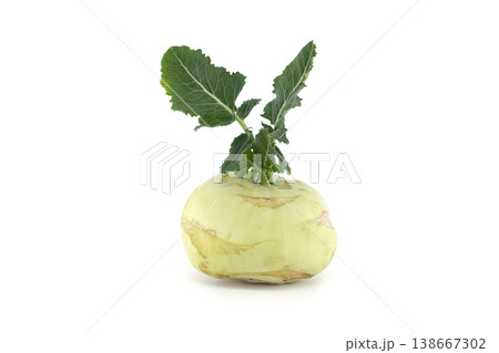 Fresh kohlrabi vegetable with green leaves isolated on a clean white background 138667302