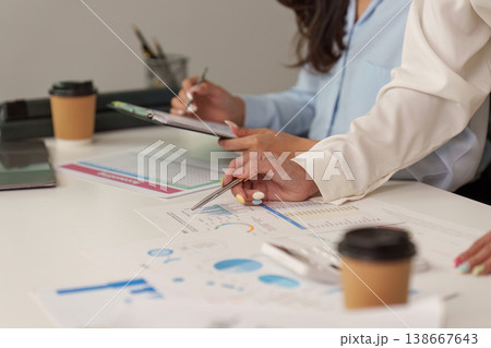 Collaborative financial analysis with charts and reports in an office 138667643