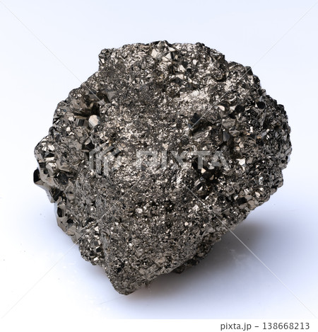 Close up view of raw pyrite crystal specimen with metallic luster and geometric golden structure on white background. Close up view of raw pyrite crystal specimen with metallic luster and geometric golden structure on white background. 138668213