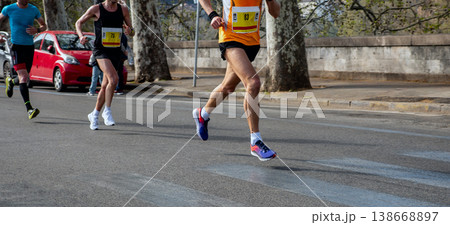 Three male athletes running marathon 138668897