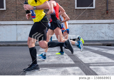 Three runners athletes running 138668901
