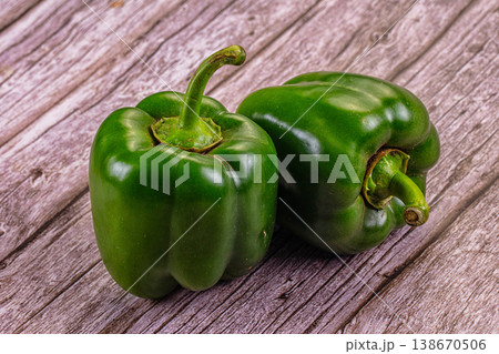 Fresh green bell peppers on a rustic table Fresh green bell peppers on a rustic table 138670506