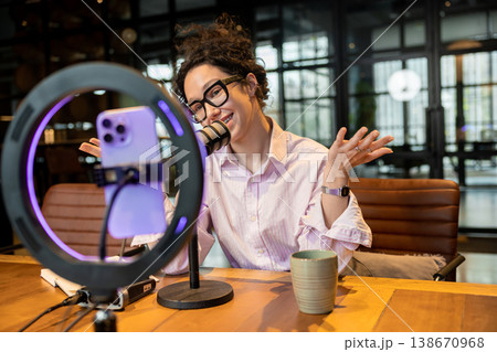 Woman host explaining idea during live video broadcast Woman host explaining idea during live video broadcast 138670968