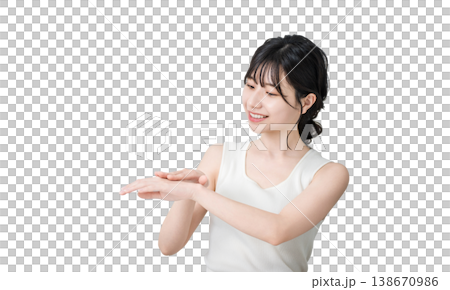 Japanese women applying hand cream to the back of their hands (skin care) 138670986