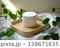 Minimalist Skincare Product on Wooden Tray Surrounded by Green Foliage 138671635