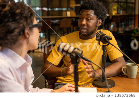 Partners discussing topics during live audio recording Partners discussing topics during live audio recording 138672669