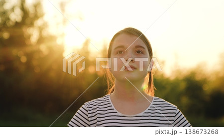 Happy girl, child girl face close-up smile, teenager sunset, people outdoors, schoolgirl child laughing park nature, dreamy soft focus, emotional storytelling photography, outdoor childhood memory Happy girl, child girl face close-up smile, teenager sunset, people outdoors, schoolgirl child laughing park nature, dreamy soft focus, emotional storytelling photography, outdoor childhood memory 138673268