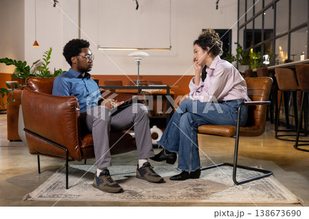 Man looking at sad woman client during session 138673690