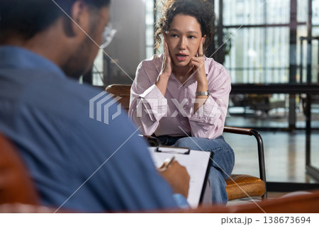 Woman client looking worried during consultation 138673694