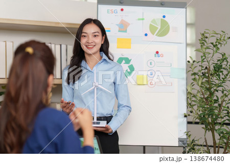 Professional presenting ESG and renewable energy concepts Professional presenting ESG and renewable energy concepts 138674480