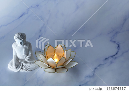 Vesak Buddha birthday. Buddha statue and lotus lamp creating peaceful atmosphere Vesak Buddha birthday. Buddha statue and lotus lamp creating peaceful atmosphere 138674517