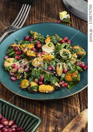 Healthy seafood salad with shrimp mussels squid and pomegranate 138674700