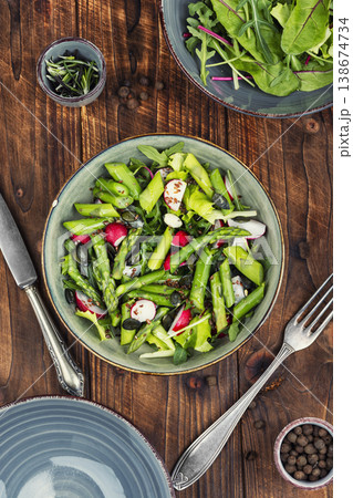 Nutritious asparagus radish salad with flax seeds 138674734