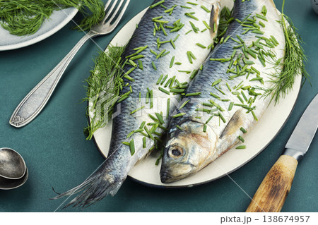 Whole Salted Herring Fish with Dill on Ceramic Plate Whole Salted Herring Fish with Dill on Ceramic Plate 138674957