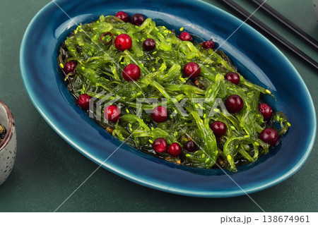 Green Seaweed Salad with Cranberries, Asian Style Dish 138674961