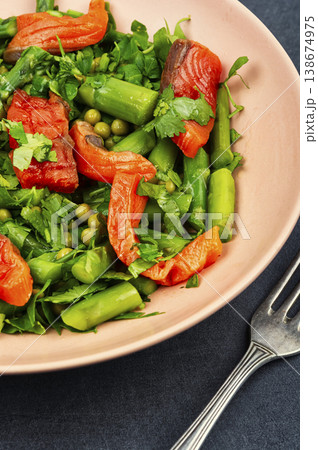 Healthy fish salad with smoked trout and asparagus. 138674975