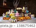 Festive Easter Table with Decorated Kulichi, Bunny Figurines and Colored Eggs 138675462