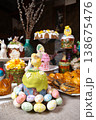 Easter Table: Kulichi in Painted Molds, Decorated Eggs, Pastries, and Figurine Chicks  138675476