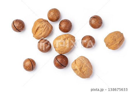 Walnut and macadamia nuts with nutshell isolated on white background Walnut and macadamia nuts with nutshell isolated on white background 138675633