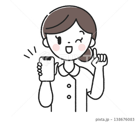スマホを持った指差しポーズの女性看護師 スマホを持った指差しポーズの女性看護師 138676083