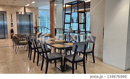 This is interior of cafe store with chair and table 138676998