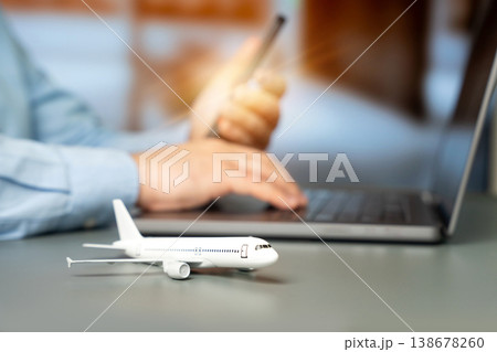 Airplane and businessman using a laptop 138678260