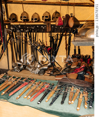 Medieval weapons and helmets at market stall in Berlin Medieval weapons and helmets at market stall in Berlin 138678351