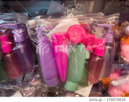 Colorful travel sized toiletries hanging in plastic bags Colorful travel sized toiletries hanging in plastic bags 138678626