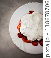 Fresh strawberries topped with fluffy whipped cream dessert for a delightful treat concept. copy space 138678706