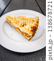 Delicious slice of crumbly apricot fruit pie on a white plate showcasing a delightful dessert concept. copy space 138678721