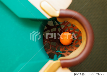 Billiard accessories balls and cue on a billiard table Billiard accessories balls and cue on a billiard table 138679777