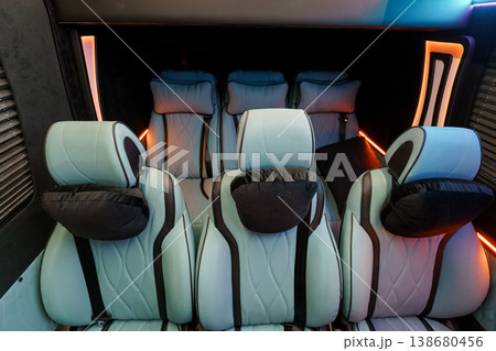 Luxury Passenger Seating Interior with Light Blue Leather and Modern Ambient Orange Lighting 138680456