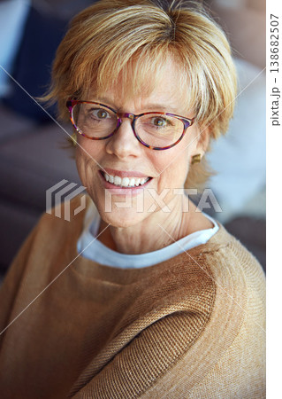 Mature, relax or portrait of happy woman in glasses in house living room with freedom, pride for resting break. Apartment, face or senior person with smile or wellness in retirement, lounge or home Mature, relax or portrait of happy woman in glasses in house living room with freedom, pride for resting break. Apartment, face or senior person with smile or wellness in retirement, lounge or home 138682507