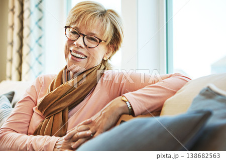 Portrait, laugh or mature woman on couch to relax with happiness on living room sofa at home. Funny, happy or senior person with smile, peace or wellness in retirement, lounge or house for resting Portrait, laugh or mature woman on couch to relax with happiness on living room sofa at home. Funny, happy or senior person with smile, peace or wellness in retirement, lounge or house for resting 138682563